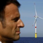 French President Emmanuel Macron visits the Saint-Nazaire offshore wind farm, off the coast of the Guerande peninsula in western France, Thursday, Sept. 22, 2022. (Stephane Mahe/Pool photo via AP)