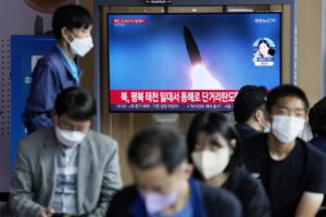 A file image of a missile launch by North Korea is shown on a news program at the Seoul Railway Station in Seoul, South Korea, Sunday, Sept. 25, 2022. North Korea fired a short-range ballistic missile Sunday toward its eastern seas, extending a provocative streak in weapons testing as a U.S. aircraft carrier visits South Korea for joint military exercises in response to the North’s growing nuclear threat.(AP Photo/Ahn Young-joon)