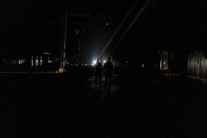 A couple walks down the middle of a street in the dark during a blackout in Havana, Cuba, Wednesday, Sept. 28, 2022. Cuba remained in the dark early Wednesday after Hurricane Ian knocked out its power grid and devastated some of the country’s most important tobacco farms when it hit the island’s western tip as a major storm. (AP Photo/Ramon Espinosa)