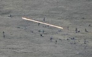 In this image taken from a YouTube footage released by Armenian Defense Ministry on Tuesday, Sept. 13, 2022, shows Azerbaijanian servicemen crossing the Armenian-Azerbaijani border and approaching the Armenian positions. Armenia’s prime minister says that 49 soldiers have been killed in nighttime attacks by Azerbaijan. (Armenian Defense Ministry via AP)