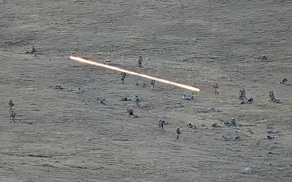 In this image taken from a YouTube footage released by Armenian Defense Ministry on Tuesday, Sept. 13, 2022, shows Azerbaijanian servicemen crossing the Armenian-Azerbaijani border and approaching the Armenian positions. Armenia’s prime minister says that 49 soldiers have been killed in nighttime attacks by Azerbaijan. (Armenian Defense Ministry via AP)