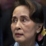 FILE – Myanmar’s leader Aung San Suu Kyi waits to address judges of the International Court of Justice in The Hague, Netherlands, Dec. 11, 2019. A court in military-ruled Myanmar convicted former leader Aung San Suu Kyi in another criminal case Thursday, Sept. 29, 2022, and sentenced Australian economist Sean Turnell to three years in prison for violating an official secrets law, a legal official said. (AP Photo/Peter Dejong, File)