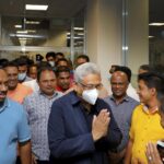 In this handout picture provided by the Ministry of Urban Development and Housing of Government of Sri Lanka, Sri Lanka’s former President Gotabaya Rajapaksa, wearing mask, is greeted upon his arrival at Bandaranaike International airport in Colombo, Sri Lanka, Saturday, Sept. 3, 2022. Gotabaya Rajapaksa, who fled the country in July after tens of thousands of protesters stormed his home and office in a display of anger over the country’s economic crisis, has returned to the country after seven weeks. (Ministry of Urban Development and Housing of Government of Sri Lanka via AP Photo)