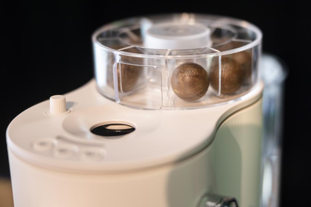 A view of coffee capsules, in a Coffee B coffee machine from the Migros brand Cafe Royal, on display at a Migros media conference, in Zurich, Tuesday, Sept. 6, 2022. Swiss retailer Migros said Tuesday that it is launching a coffee-making system designed to replace capsules which produces thousands of tons of waste worldwide each year. (Michael Buholzer/Keystone via AP)