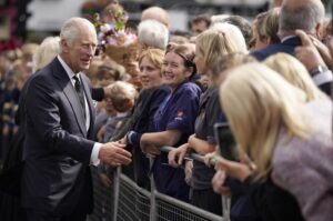 Britain’s King Charles III meets wellwishers outside Hillsborough Castle, Belfast, Tuesday Sept. 13, 2022. King Charles III is flying to Northern Ireland on the latest leg of his tour of the nations that make up the United Kingdom as thousands of people have lined up through the night to pay their last respects to his mother’s coffin in Edinburgh. (Niall Carson/Pool via AP)