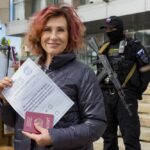 FILE – A woman shows her ballot to journalists prior to voting in a referendum in Luhansk, Luhansk People’s Republic controlled by Russia-backed separatists, eastern Ukraine, Saturday, Sept. 24, 2022. Voting began Friday in four Moscow-held regions of Ukraine on referendums to become part of Russia. (AP Photo/File)