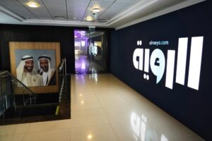 A painting of Sheikh Zayed bin Sultan Al Nahyan, the late leader of the United Arab Emirates and ruler of Abu Dhabi, left, and Sheikh Rashid bin Saeed Al Maktoum, the late ruler of Dubai, hangs outside the offices of the offices of the Al Roeya newspaper in Dubai, UAE, Sept. 3, 2022. A state-linked newspaper published a story this summer about a hot-button issue in the country: How Emiratis are coping with high fuel prices. It ended up seeing over 40 people fired and the paper was declared dissolved. The purge at Al Roeya newspaper reflects the intense challenges facing local journalists in the UAE. (AP Photo/Jon Gambrell)