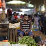 FILE – A vender waits for customers at a vegetable market place in Colombo, Sri Lanka, Friday, June 10, 2022. The International Monetary Fund said Thursday, Sept. 1, 2022, it has reached a staff-level agreement with Sri Lanka to provide $ 2.9 billion over four years to help salvage the country from its worst economic crisis in recent memory. (AP Photo/Eranga Jayawardena, File)