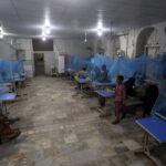 Pakistani patients suffering from dengue fever, a mosquito-borne disease, are treated in an isolation ward, at a hospital in Karachi, Pakistan, Saturday, Sept. 24, 2022. Pakistan has deployed thousands of additional doctors and paramedics in the country’s worst flood-hit province to contain the spread of diseases that have killed hundreds of people among the flood victims, officials said Friday. (AP Photo/Fareed Khan)