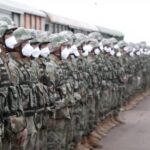In this handout photo taken from video released by Russian Defense Ministry Press Service on Monday, Aug. 29, 2022, Chinese soldiers arrive to the Grodekovo railway station to participate in war games drills, in Grodekovo, Primorsky Krai, Russia. Russia said Monday it will launch sweeping war games drills in the country’s east that will involve forces from China — a show of increasingly close military ties between Moscow and Beijing amid tensions with the West over the Kremlin’s action in Ukraine. (Russian Defense Ministry Press Service via AP)