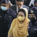 Rosmah Mansor, center, wife of former Malaysian Prime Minister Najib Razak, arrives at Kuala Lumpur High Court in Kuala Lumpur, Thursday, Sept. 1, 2022. The wife of jailed ex-Prime Minister Najib Razak arrived in court Thursday, for a verdict in her corruption trial involving a 1.25 billion ringgit ($279 million) solar energy project, just days after her husband was imprisoned over the looted 1MDB state fund. (AP Photo/Vincent Thian)