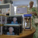 Tea tins featuring pictures of Queen Elizabeth II are displayed for sale at a gift shop in London, Monday, Sept. 12, 2022. Just days after the death of Queen Elizabeth II, unofficial souvenirs have rolled out at royal-themed gift shops in London and online marketplaces like Amazon and Etsy. (AP Photo/Kin Cheung)