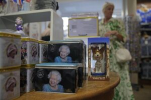 Tea tins featuring pictures of Queen Elizabeth II are displayed for sale at a gift shop in London, Monday, Sept. 12, 2022. Just days after the death of Queen Elizabeth II, unofficial souvenirs have rolled out at royal-themed gift shops in London and online marketplaces like Amazon and Etsy. (AP Photo/Kin Cheung)