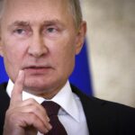 Russian President Vladimir Putin gestures as he speaks to the media after the Shanghai Cooperation Organisation (SCO) summit in Samarkand, Uzbekistan, Friday, Sept. 16, 2022. (Sergei Bobylev, Sputnik, Kremlin Pool Photo via AP)