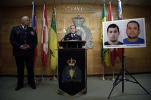Assistant Commissioner Rhonda Blackmore speaks while Regina Police Chief Evan Bray, left, looks on during a press conference at RCMP “F” Division Headquarters in Regina, Saskatchewan, on Sunday, Sept. 4, 2022. Damien Sanderson and Myles Sanderson allegedly stabbed and killed 10 people between James Smith Cree Nation and Weldon, Saskatchewan, on Sunday morning, and the pair are presently at large. (Michael Bell/The Canadian Press via AP)