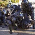 Russian policemen detain demonstrators protesting against mobilization in St. Petersburg, Russia, Saturday, Sept. 24, 2022. (AP Photo)