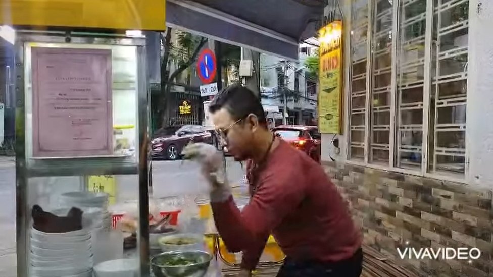 Noodle vendor Bui Tuan Lam was issued a police summons after posting a video of himself theatrically preparing and seasoning a bowl of beef noodles