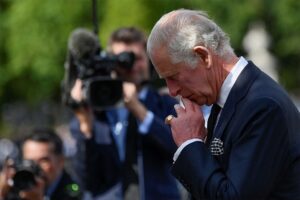 King Charles reflected on floral tributes left outside the palace following the death of his mother, the Queen