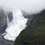 A glacier is pictured calving into the river, in Queulat National Park, in Aysen, Chile September 9, 2022. Courtesy Surreal Travel/Handout via REUTERS