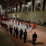 The guard is changed while members of the public pay their respects as they pass the coffin of Queen Elizabeth II as it Lies in State inside Westminster Hall, at the Palace of Westminster in London on September 14, 2022. BEN STANSALL/Pool via REUTERS