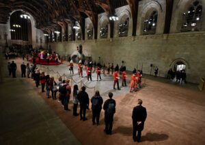 The guard is changed while members of the public pay their respects as they pass the coffin of Queen Elizabeth II as it Lies in State inside Westminster Hall, at the Palace of Westminster in London on September 14, 2022. BEN STANSALL/Pool via REUTERS
