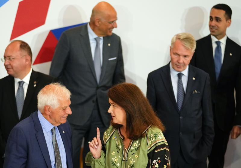 Sweden’s Foreign Minister Ann Linde, center, speaks with European Union foreign policy chief Josep Borrell, second left, during a group photo of EU foreign ministers at the Prague Congress Center in Prague, Czech Republic, Wednesday, Aug. 31, 2022. Others from left, Romania’s Foreign Minister Bogdan Aurescu, Greek Foreign Minister Nikos Dendias, Finland’s Foreign Minister Pekka Haavisto and Italy’s Foreign Minister Luigi Di Maio. (AP Photo/Petr David Josek)