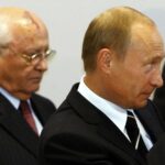 FILE – Russian President Vladimir Putin, right, and former Soviet leader Mikhail Gorbachev arrives at the German-Russian Petersburg Dialogue conference in Dresden on Tuesday, Oct. 10, 2006. Russian President Vladimir Putin met with German Chancellor Angela Merkel on Tuesday for talks about Iran’s nuclear program and growing Russian-German economic ties, revisiting the city where he once served as a KGB spy. (AP Photo/Markus Schreiber, File)