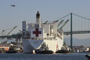 FILE – The USNS Mercy hospital ship enters the Port of Los Angeles, March 27, 2020. The Solomon Islands government on Wednesday, Aug. 31, 2022, asked countries to not send naval vessels to the South Pacific nation until approval processes are overhauled. The U.S. Navy hospital ship USNS Mercy is currently in Honiara. (AP Photo/Mark J. Terrill, File)