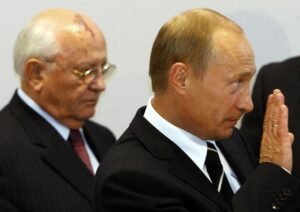 FILE – Russian President Vladimir Putin, right, and former Soviet leader Mikhail Gorbachev arrives at the German-Russian Petersburg Dialogue conference in Dresden on Tuesday, Oct. 10, 2006. Russian President Vladimir Putin met with German Chancellor Angela Merkel on Tuesday for talks about Iran’s nuclear program and growing Russian-German economic ties, revisiting the city where he once served as a KGB spy. (AP Photo/Markus Schreiber, File)