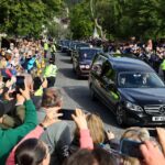 The hearse carrying the coffin of Britain’s Queen Elizabeth passes through the village of Ballater, near Balmoral, Scotland, Britain, September 11, 2022. REUTERS/Kai Pfaffenbach