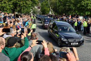 The hearse carrying the coffin of Britain’s Queen Elizabeth passes through the village of Ballater, near Balmoral, Scotland, Britain, September 11, 2022. REUTERS/Kai Pfaffenbach