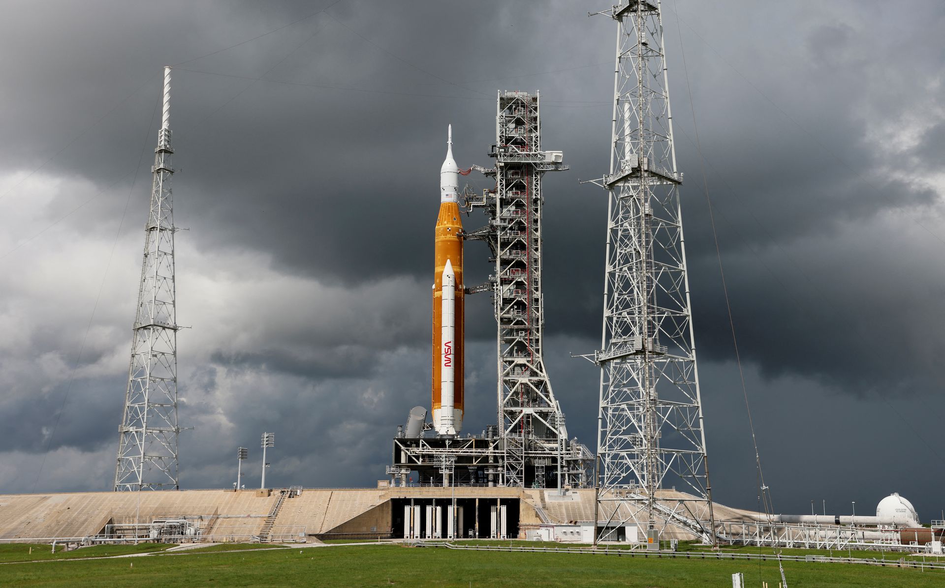 NASA’s next-generation moon rocket, the Space Launch System (SLS) with the Orion crew capsule perched on top, stands on launch complex 39B as rain clouds move into the area before its rescheduled debut test launch for the Artemis 1 mission at Cape Canaveral, Florida, U.S. September 2, 2022. REUTERS/Joe Skipper