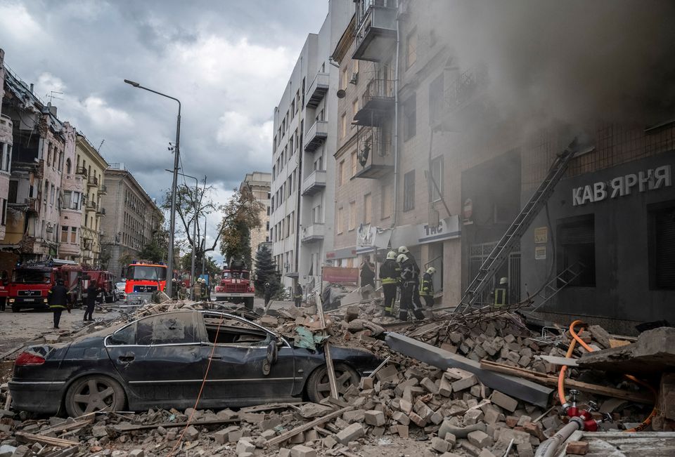 Firefighters work at the site of a residential building hit by a Russian military strike, amid Russia’s attack on Ukraine, in Kharkiv, Ukraine September 6, 2022. REUTERS/Viacheslav Ratynskyi