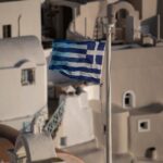 Greek national flag flutters in Oia, following the coronavirus disease (COVID-19) outbreak, on the island of Santorini, Greece, May 6, 2020. REUTERS/Alkis Konstantinidis
