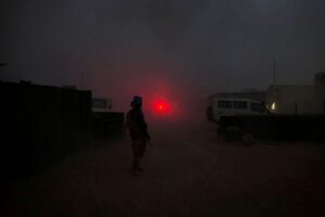 A United Nations peacekeeper secures the MINUSMA base after a mortar attack in Kidal Mali. MINUSMA/Sylvain Liechti handout via REUTERS