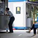 A man gets a swab at a nucleic acid testing booth following a coronavirus disease (COVID-19) outbreak in Beijing, China, September 13, 2022. REUTERS/Thomas Peter