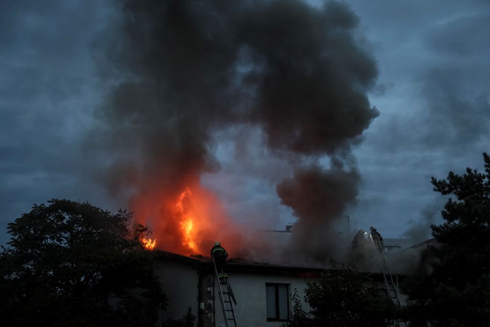 Ukrainian firefighters put out a fire in a residential house after a Russian military strike, as Russia’s attack in Ukraine continues, in Kharkiv, Ukraine September 10, 2022. REUTERS/Gleb Garanich