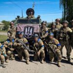 Service members of the State Security Service of Ukraine pose for a picture in the recently liberated town of Kupiansk, amid Russia’s attack on Ukraine, in Kharkiv region, Ukraine in this handout picture released September 10, 2022. Press Service of the State Security Service of Ukraine/Handout via REUTERS