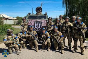 Service members of the State Security Service of Ukraine pose for a picture in the recently liberated town of Kupiansk, amid Russia’s attack on Ukraine, in Kharkiv region, Ukraine in this handout picture released September 10, 2022. Press Service of the State Security Service of Ukraine/Handout via REUTERS