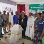 Mr Festus Alenkhe flanked by dignitaries during the programme in Benin City