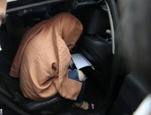 A woman, believed to be the mother of two children whose remains were found in suitcases in New Zealand last month, is transported to prosecutors’ office, in Ulsan, South Korea, September 15, 2022. Yonhap via REUTERS