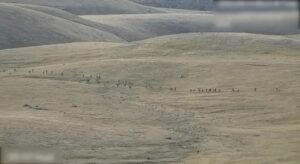 A still image from video, released by the Armenian Defence Ministry, shows what it said to be Azerbaijani service members moving along an unidentified mountainous border area with Armenia, in this still image taken from handout footage released September 13, 2022. Armenian Defence Ministry/Handout via REUTERS
