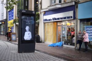 A billboard shows a picture of Britain’s Queen Elizabeth, following her passing, in Cardiff, Britain, September 9, 2022. REUTERS/Molly Darlington