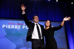 Leadership candidate Pierre Poilievre and wife Anaida Poilievre wave onstage during Canada’s Conservative Party leadership election in Ottawa, Ontario, Canada September 10, 2022. REUTERS/Blair Gable
