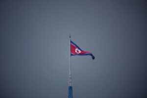 A North Korean flag flutters at the propaganda village of Gijungdong in North Korea, in this picture taken near the truce village of Panmunjom inside the demilitarized zone (DMZ) separating the two Koreas, South Korea, July 19, 2022. REUTERS/Kim Hong-Ji/Pool