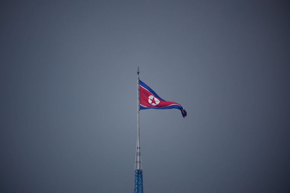 A North Korean flag flutters at the propaganda village of Gijungdong in North Korea, in this picture taken near the truce village of Panmunjom inside the demilitarized zone (DMZ) separating the two Koreas, South Korea, July 19, 2022. REUTERS/Kim Hong-Ji/Pool