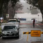 Floodwaters begin to recede after inundating a residential area, following heavy rains and severe flooding in the McGraths Hill suburb of Sydney, Australia, July 6, 2022. REUTERS/Loren Elliott/File Photo