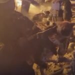 In this image made from video, a firefighter holds a kitten after rescuing it from a burning building in Kharkiv, Ukraine, Sunday, Sept. 4, 2022. Ukraine’s emergency services posted video to Facebook on Sunday showing the firefighters petting and cuddling the kitten as they carried it to safety. One said, “We found a beauty.” Ukraine’s emergency services said the kitten’s paw needed medical attention. (State Emergency Service of Ukraine via AP)