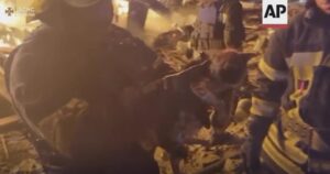 In this image made from video, a firefighter holds a kitten after rescuing it from a burning building in Kharkiv, Ukraine, Sunday, Sept. 4, 2022. Ukraine’s emergency services posted video to Facebook on Sunday showing the firefighters petting and cuddling the kitten as they carried it to safety. One said, “We found a beauty.” Ukraine’s emergency services said the kitten’s paw needed medical attention. (State Emergency Service of Ukraine via AP)