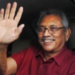 FILE- Sri Lanka’s president elect Gotabaya Rajapaksa waves to supporters as he leaves the election commission after the announcement of his victory in Colombo, Sri Lanka, Sunday, Nov. 17, 2019, file photo. The ousted President is expected to return home Friday, Sept. 2, 2022, more than seven weeks after he fled the country amid mass protests that demanded his resignation, holding him and his family responsible for the country’s economic crisis. (AP Photo/Eranga Jayawardena, File)